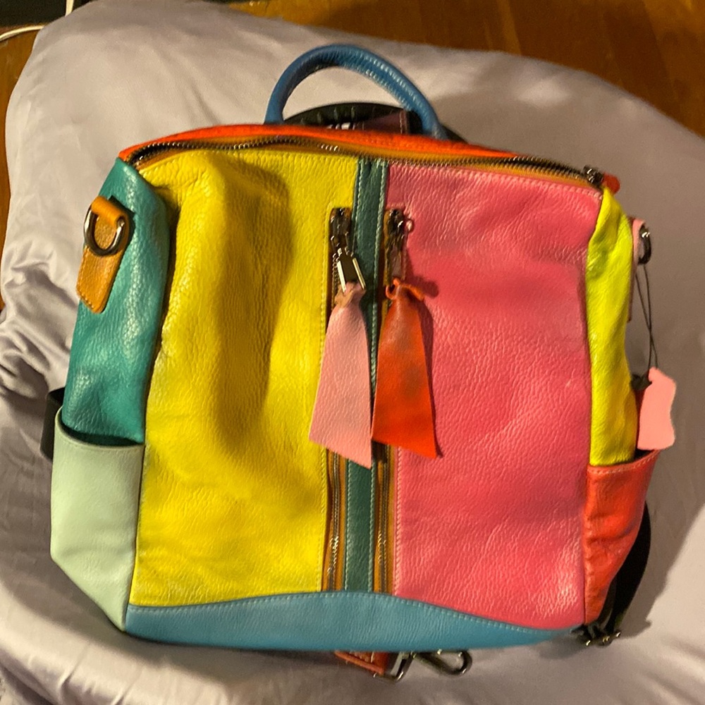 Multicolored leather backpack. Many pockets.